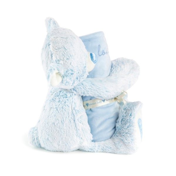 A light blue teddy bear with a blue nose and blue hearts on its paws holding a rolled soft blue blanket that says "loved".