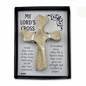 Black box with clear cover, inside has white cardboard with black script, containing 4" tan resin cross.