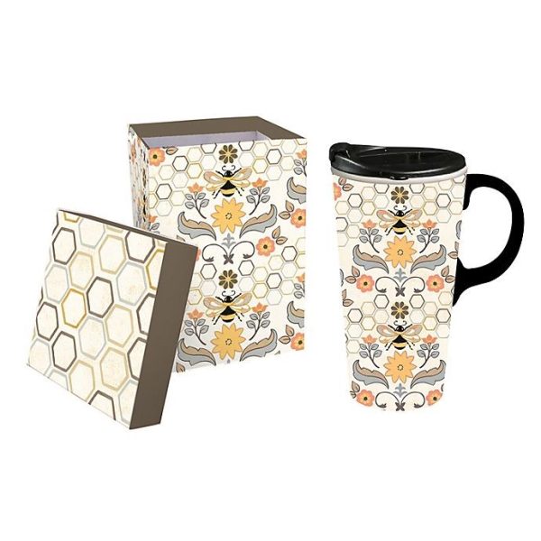 Ceramic mug with a honeycomb design sits next to a giftbox with the same design